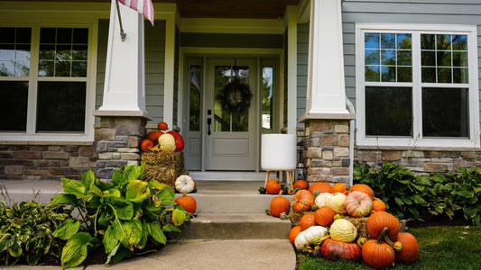 Fall porch display on a Craftsman-style home